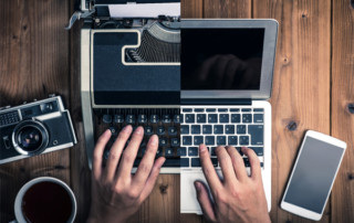 A photo of someone typing on a laptop